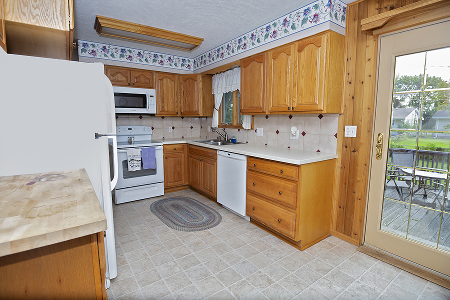1313 Rutledge Road Bloomington, IL 61704 - Photo 9 of 29 a kitchen with stainless steel appliances granite countertop a stove a sink and a refrigerator