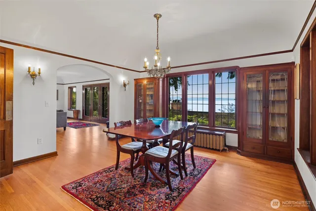 a view of a dining room with furniture window and wooden floor