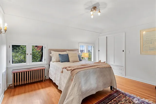 a bedroom with a bed and window