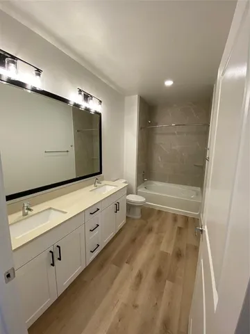 a bathroom with a sink and a large mirror