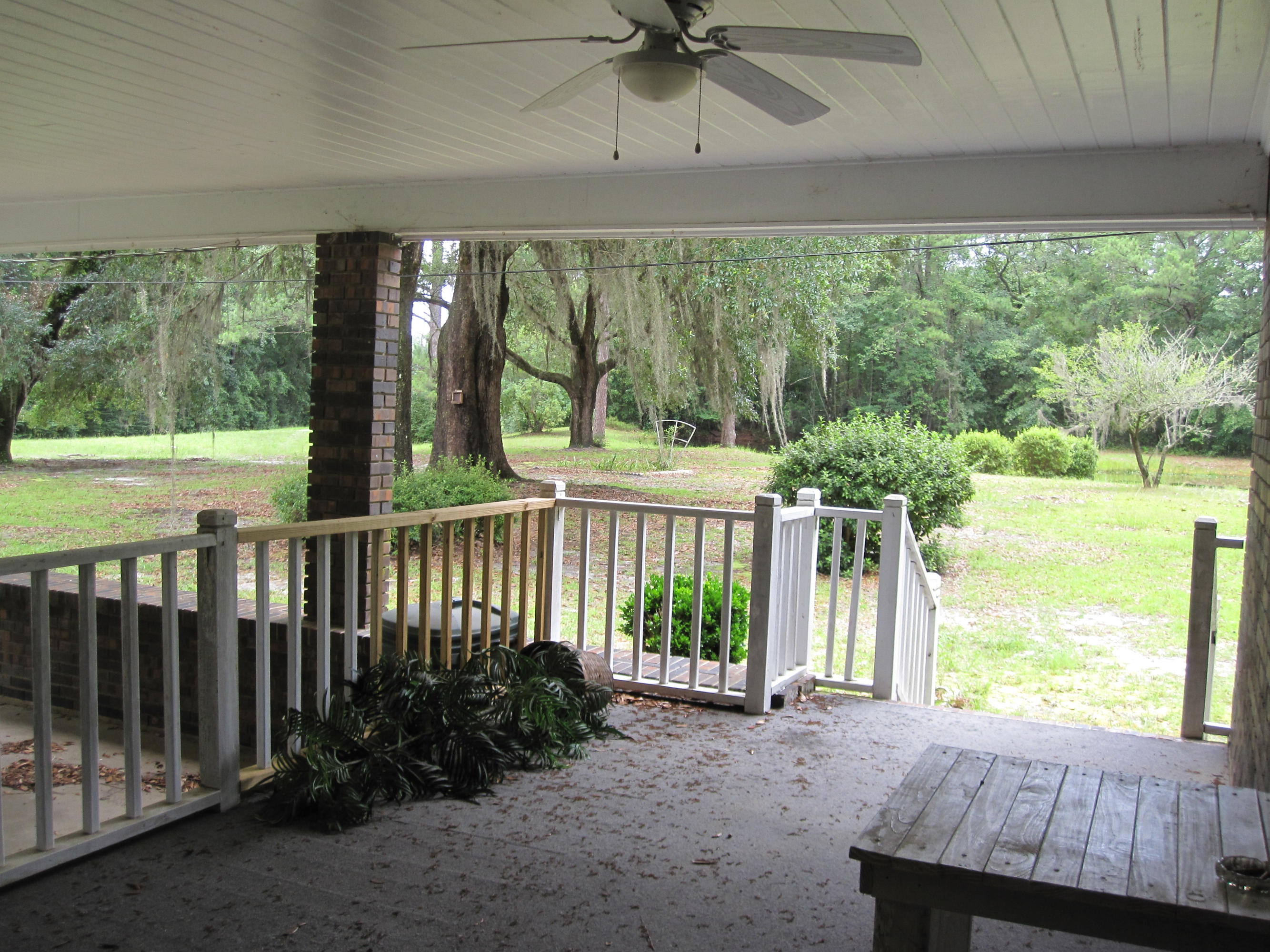 5260 Old River Road Baker, FL 32531 - Photo 4 of 30 a view of a porch with a yard
