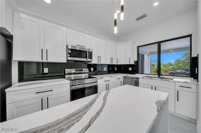 $310,000 | 907 East 9th Street, Lehigh Acres, FL 33972