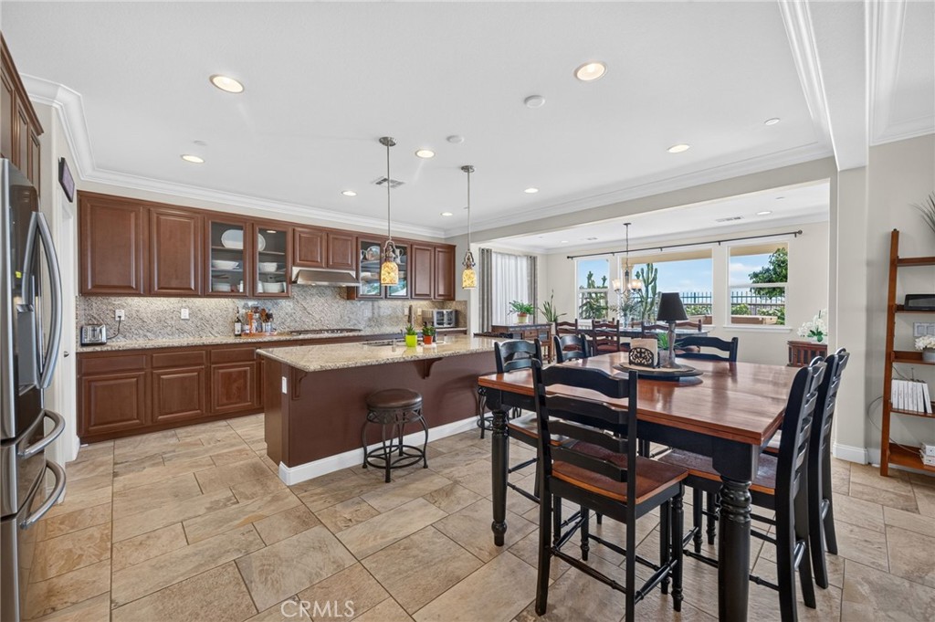 31749 Country View Road Temecula, CA 92591 - Photo 14 of 68 a kitchen with a table chairs sink and cabinets