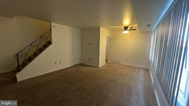 a view of a hallway with a door