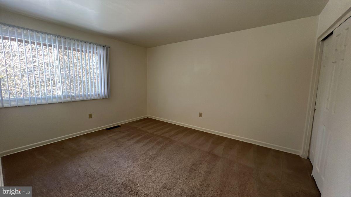 926 Taney Avenue, Unit 926 Frederick, MD 21702 - Photo 6 of 8 an empty room with a window