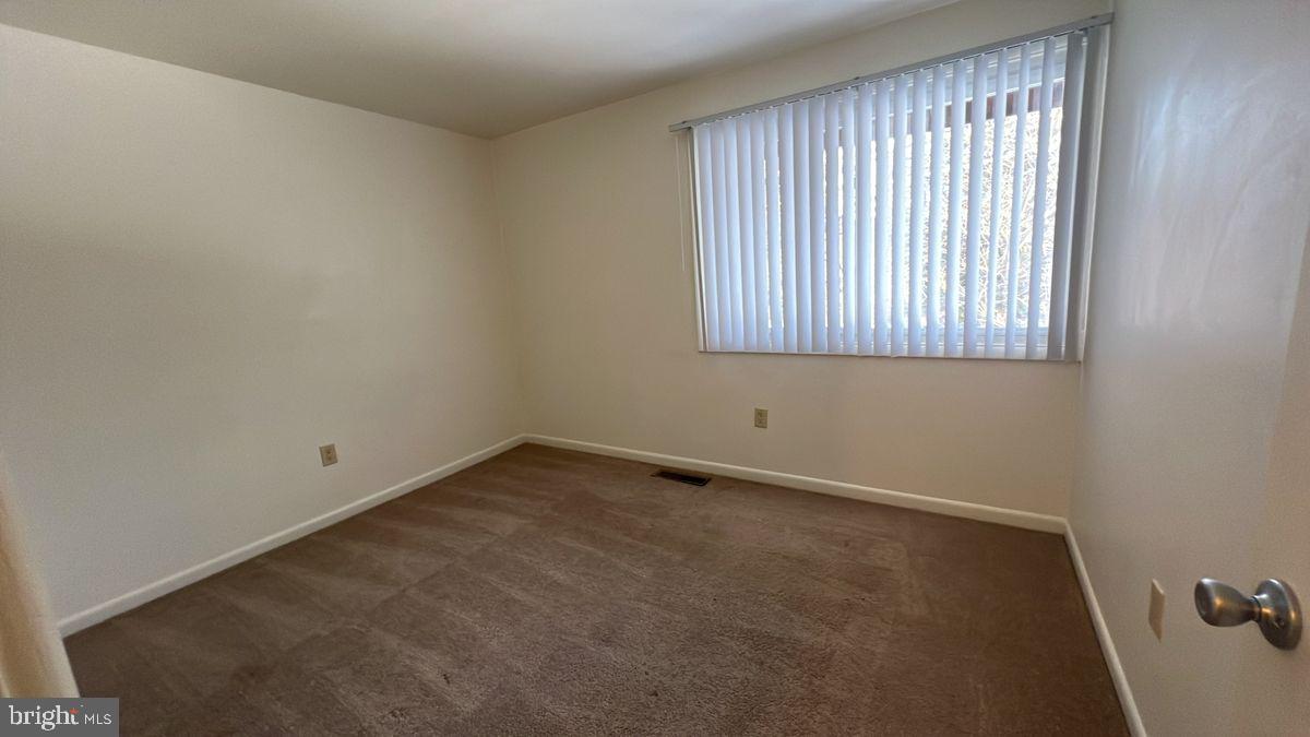 926 Taney Avenue, Unit 926 Frederick, MD 21702 - Photo 7 of 8 an empty room with a window