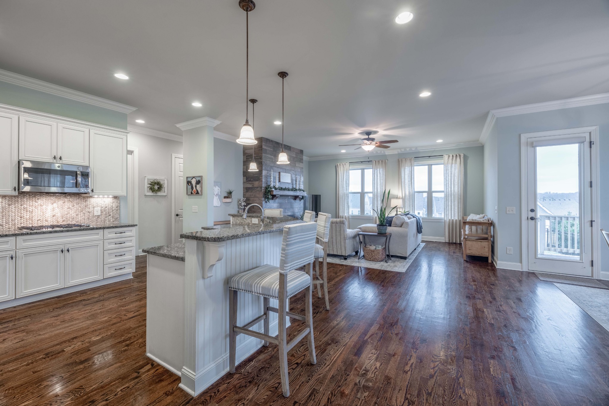 148 Truman Road West Franklin, TN 37064 - Photo 13 of 41 a kitchen with a dining table chairs wooden floor appliances and cabinets