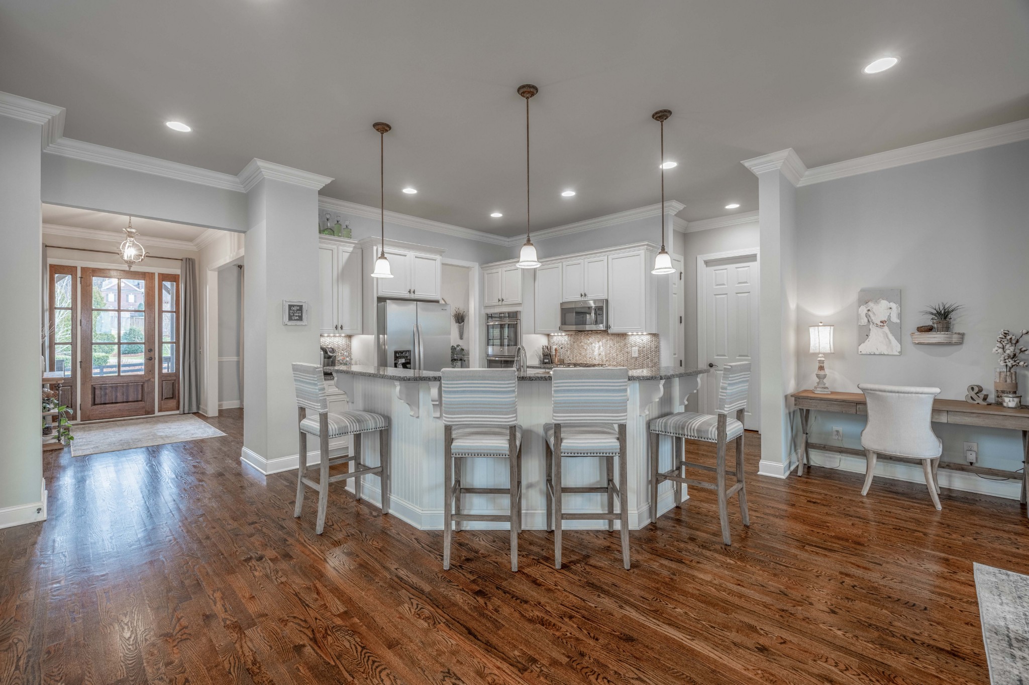 148 Truman Road West Franklin, TN 37064 - Photo 9 of 41 a dining room with stainless steel appliances furniture wooden floor and a kitchen view