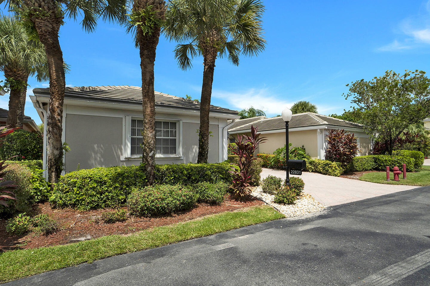 22831 Windsor Wood Court Boca Raton, FL 33433 - Photo 5 of 48 front view of a house with a yard