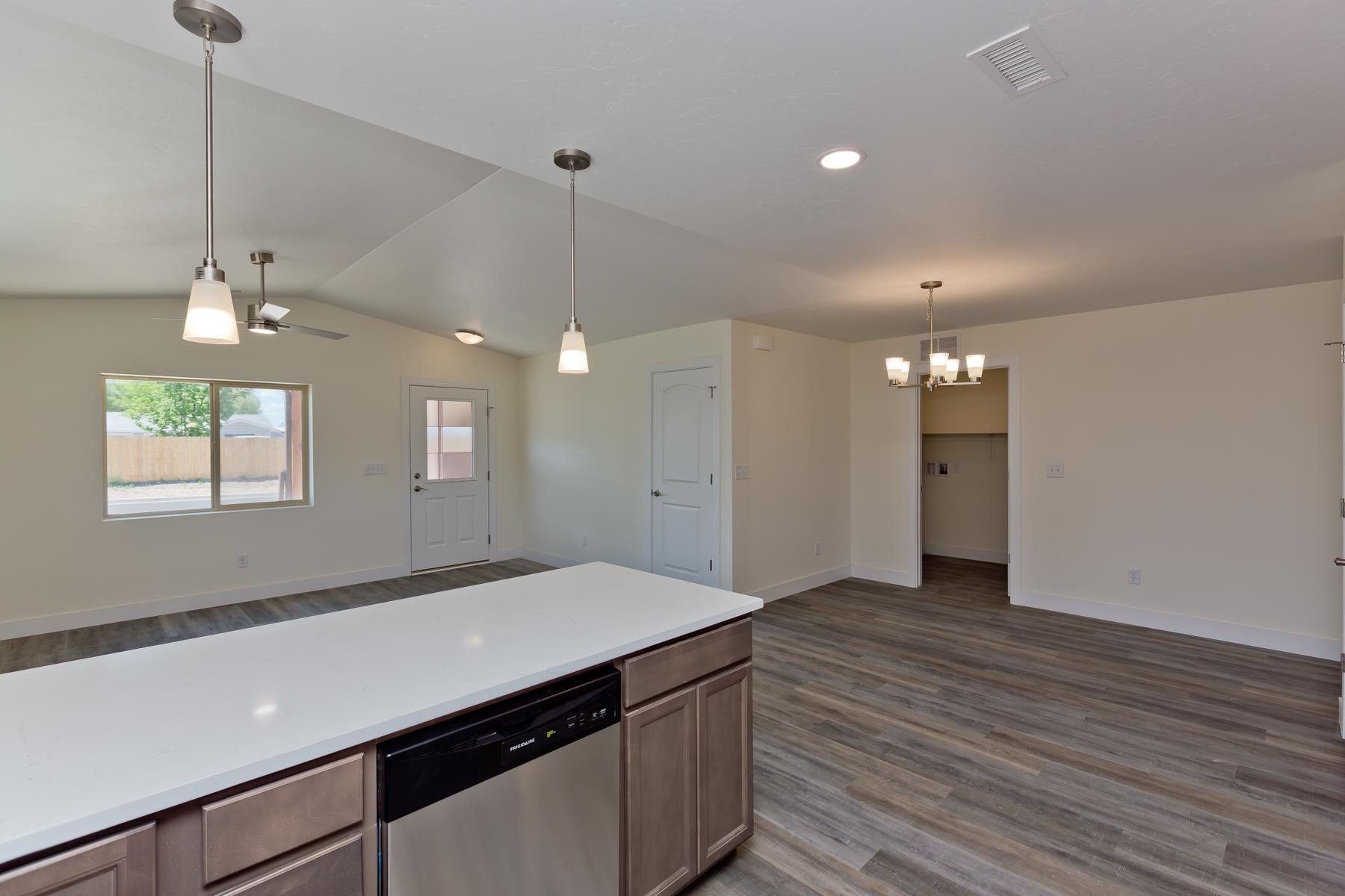 660 Nuvue Street Delta, CO 81416 - Photo 12 of 35 a view of a kitchen with a sink and wooden floor