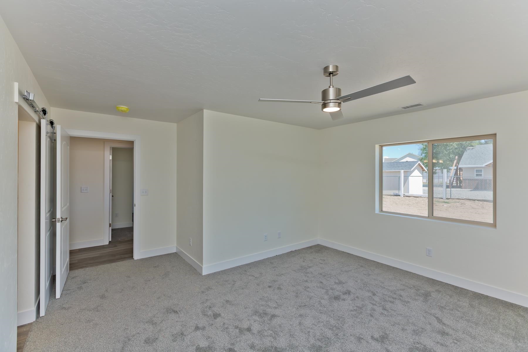 660 Nuvue Street Delta, CO 81416 - Photo 15 of 35 a view of an empty room with a window