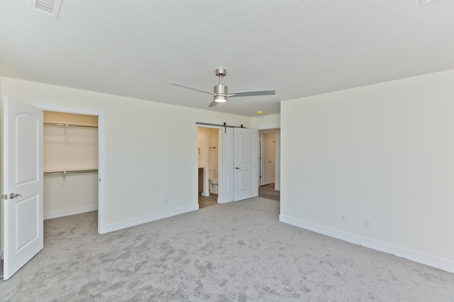 660 Nuvue Street Delta, CO 81416 - Photo 16 of 35 an empty room with a ceiling fan