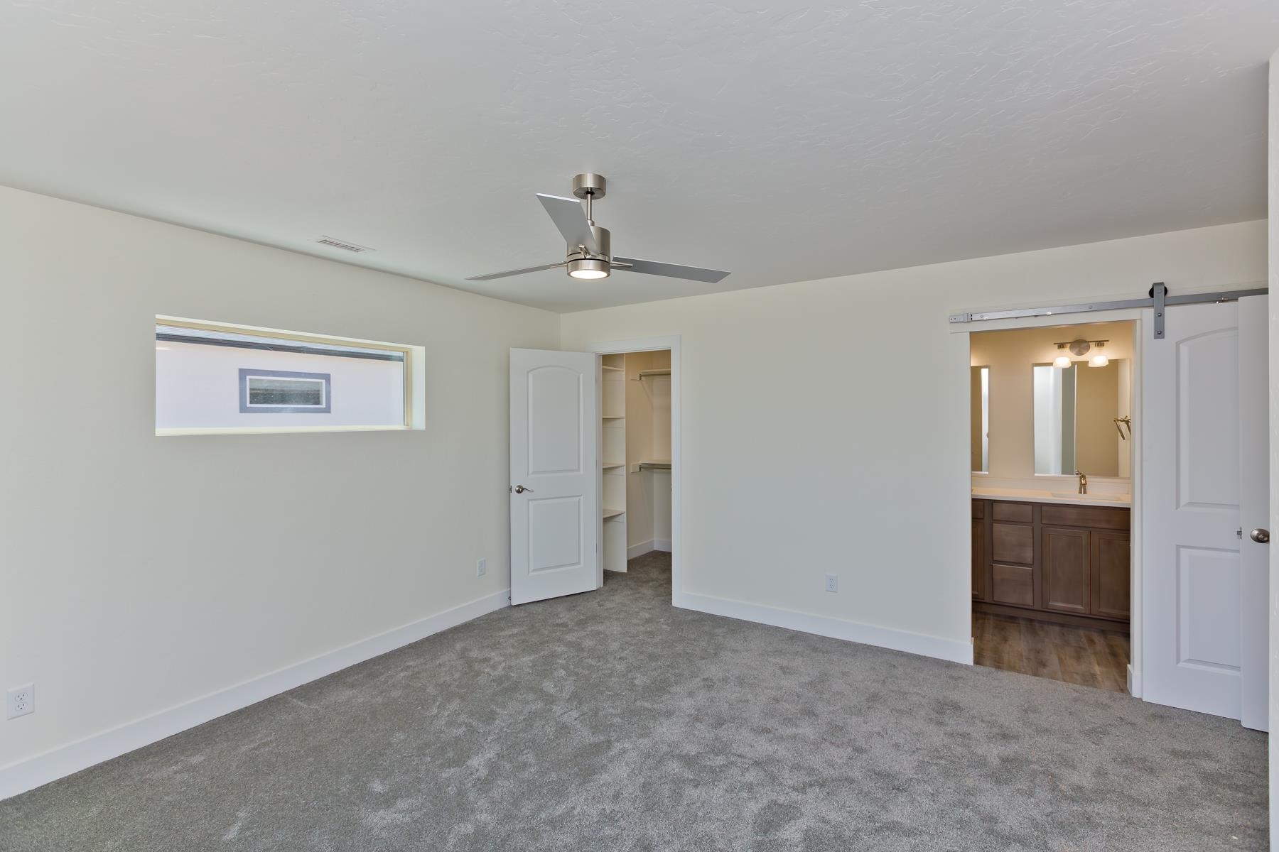 660 Nuvue Street Delta, CO 81416 - Photo 17 of 35 a view of an empty room with a window