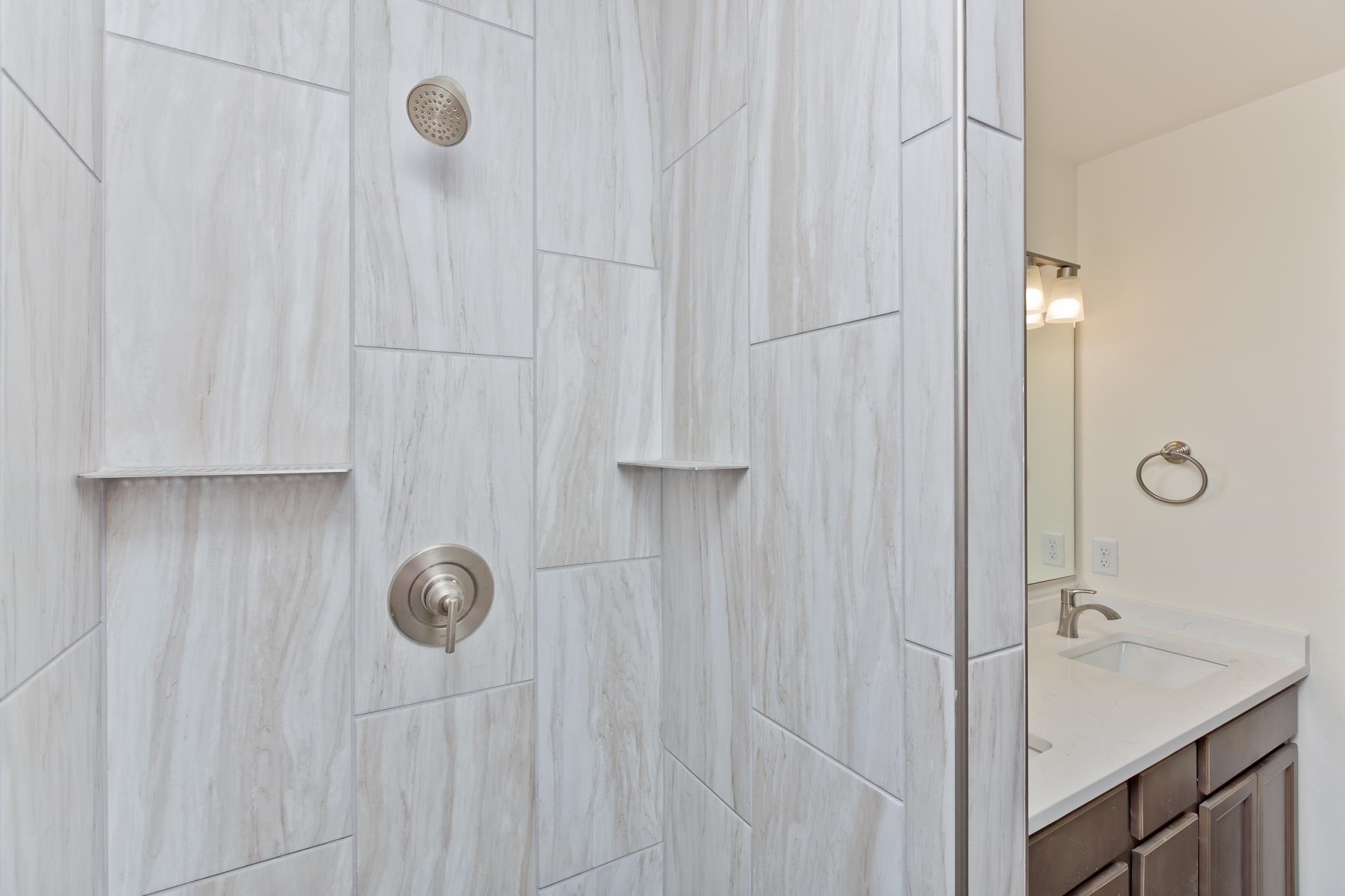660 Nuvue Street Delta, CO 81416 - Photo 20 of 35 a bathroom with a shower and a sink
