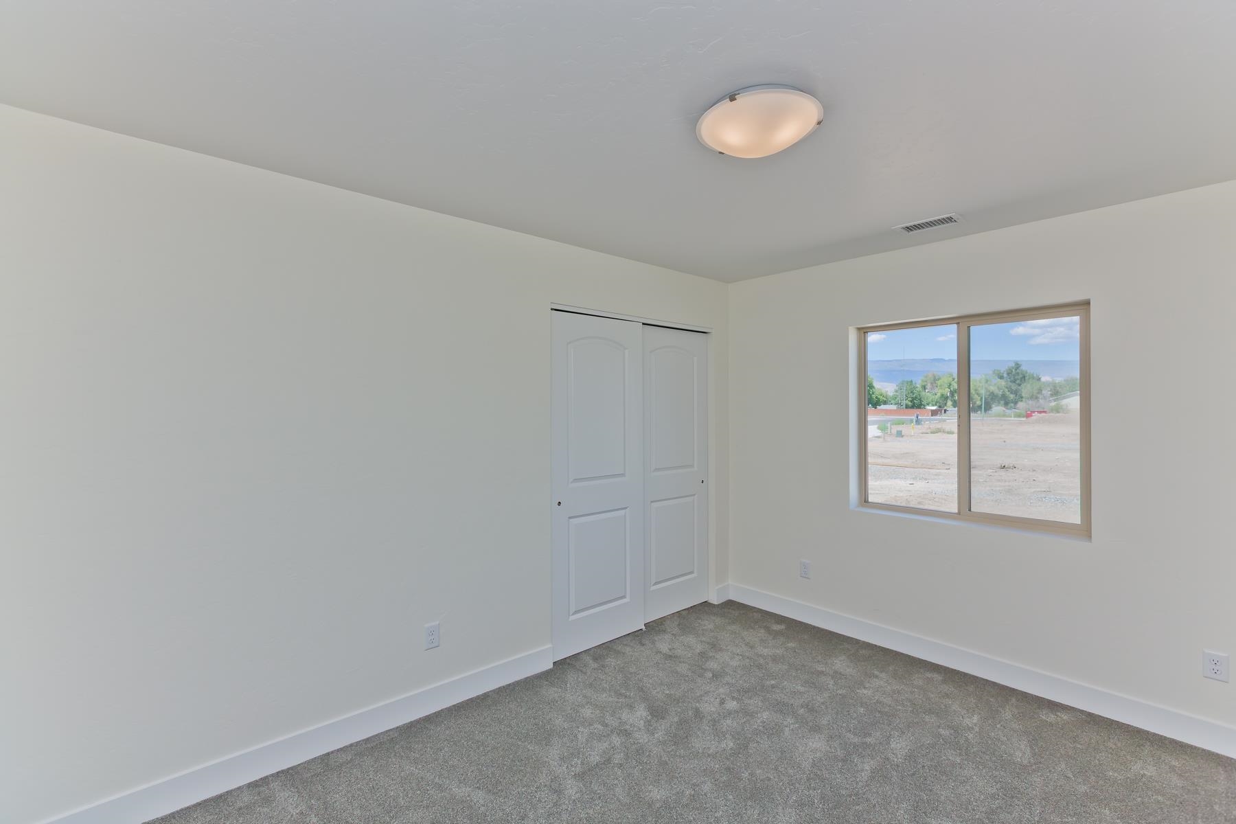 660 Nuvue Street Delta, CO 81416 - Photo 29 of 35 an empty room with a window