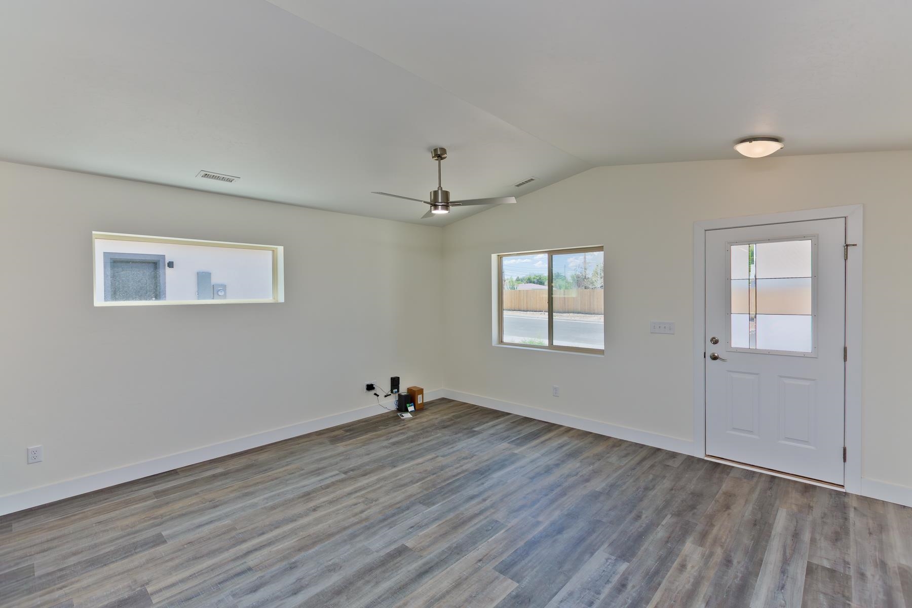 660 Nuvue Street Delta, CO 81416 - Photo 5 of 35 wooden floor in an empty room with a window