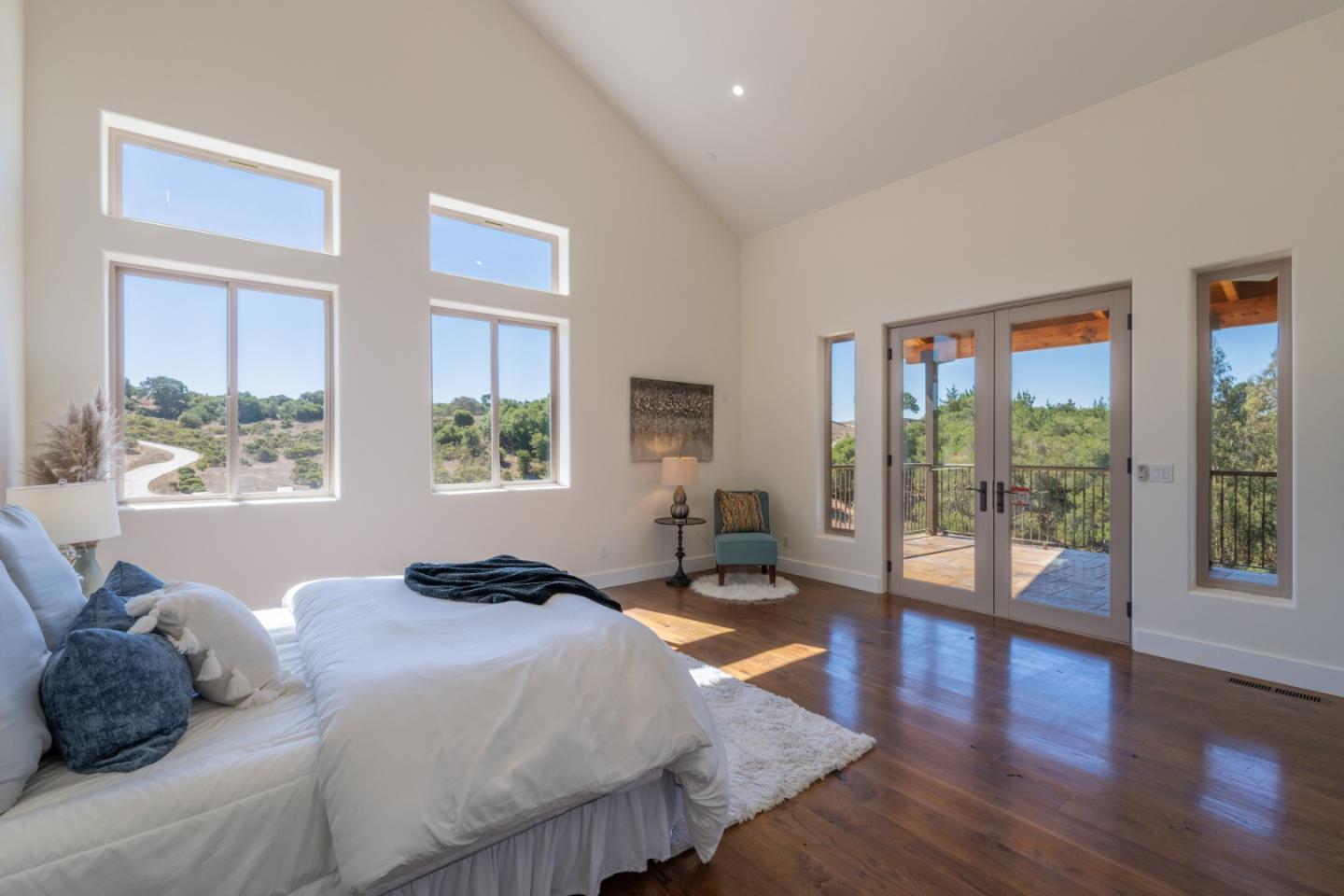 9020 Hidden Canyon Road Salinas, CA 93907 - Photo 37 of 58 a bedroom with a large bed and a large window