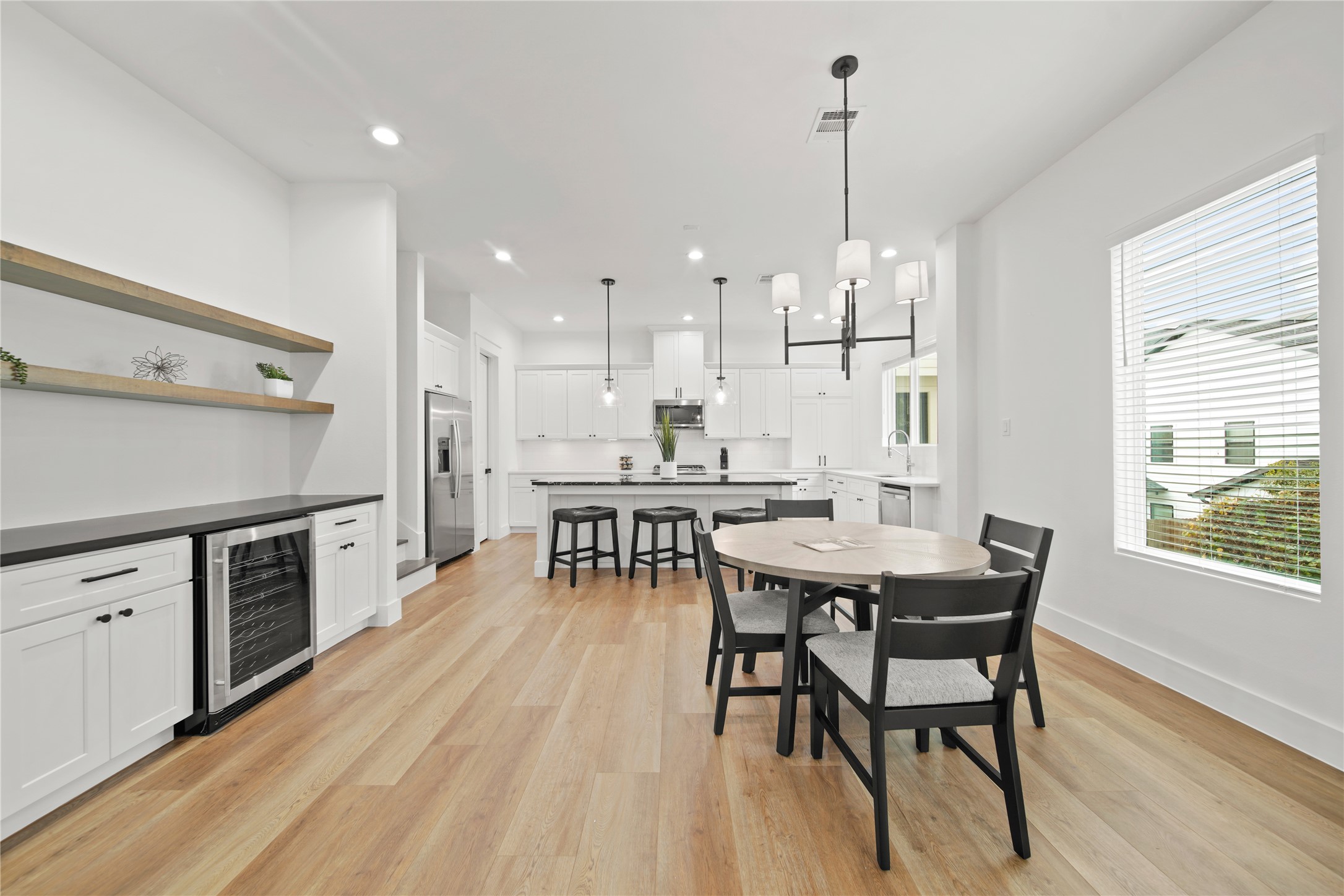 2510 Gray Street Houston, TX 77003 - Photo 11 of 15 a kitchen with stainless steel appliances kitchen island granite countertop a table chairs sink and cabinets