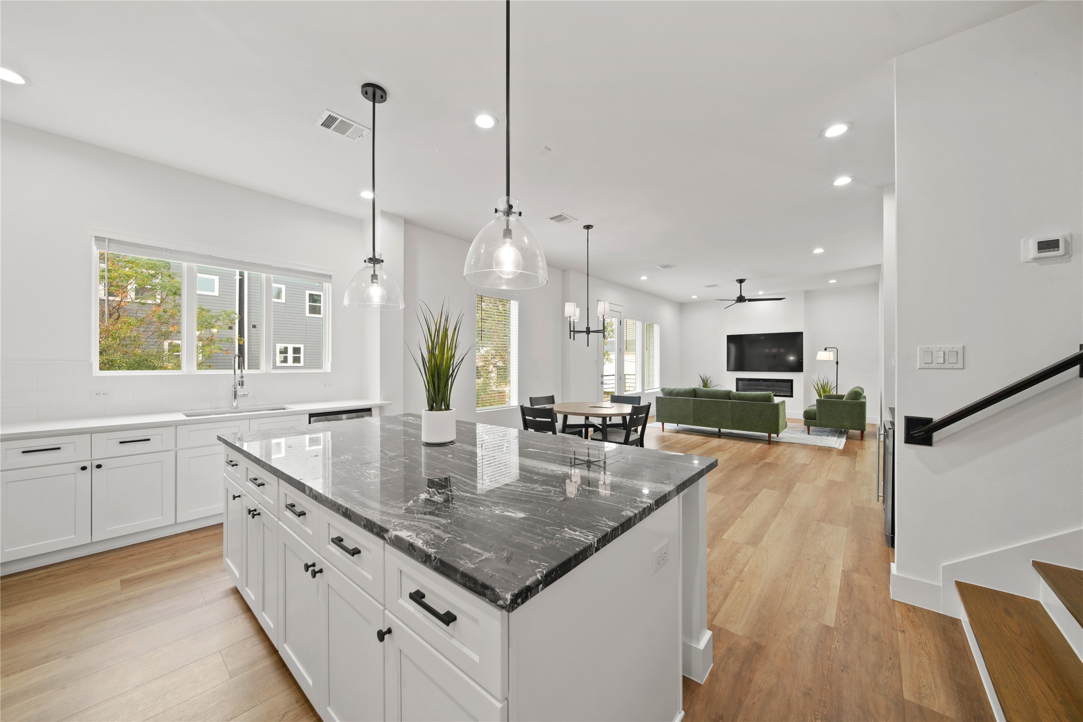 2510 Gray Street Houston, TX 77003 - Photo 15 of 15 a large kitchen with kitchen island granite countertop a stove a sink a center island and living room view