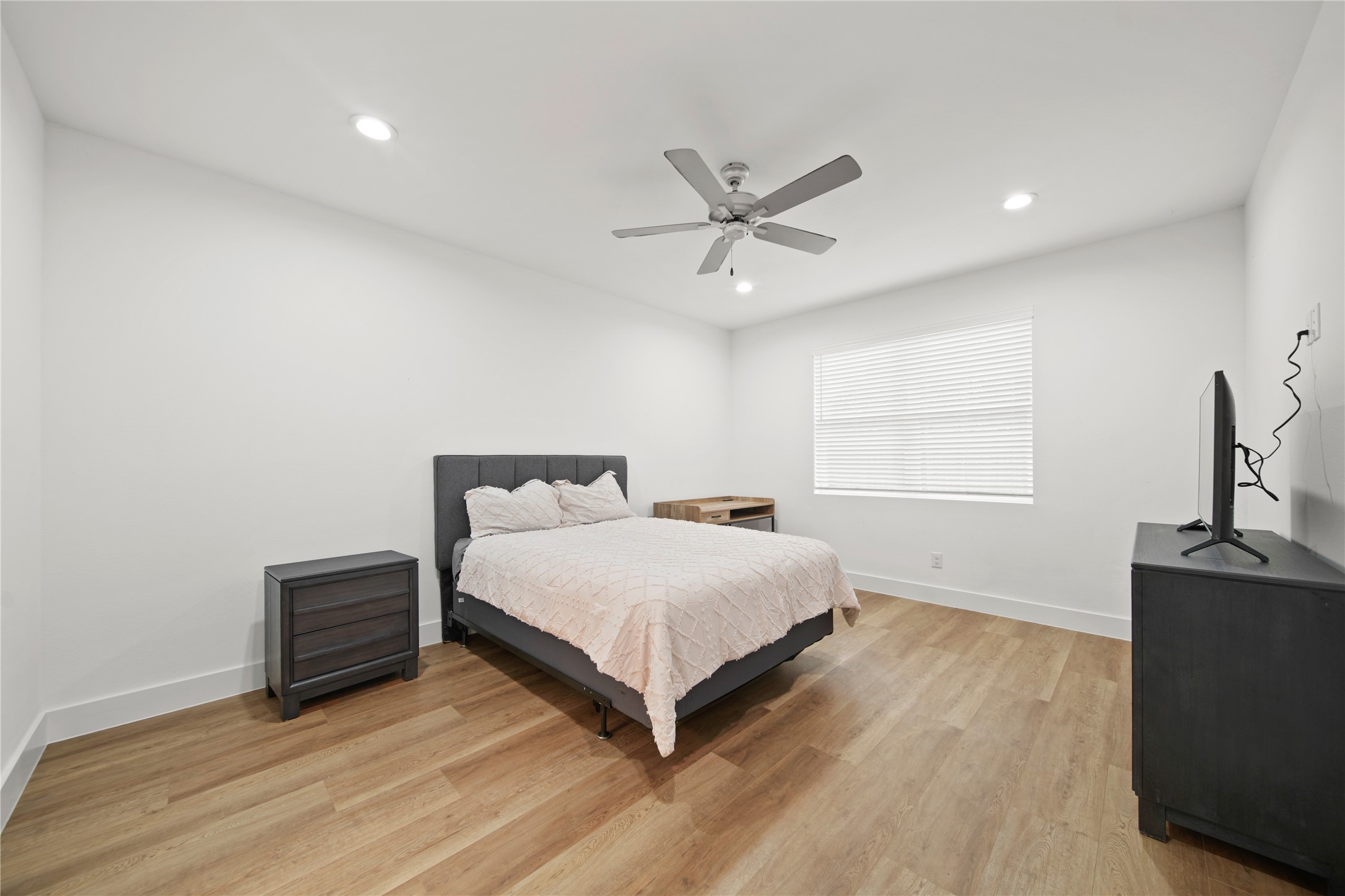 2510 Gray Street Houston, TX 77003 - Photo 3 of 15 a bedroom with a bed and window