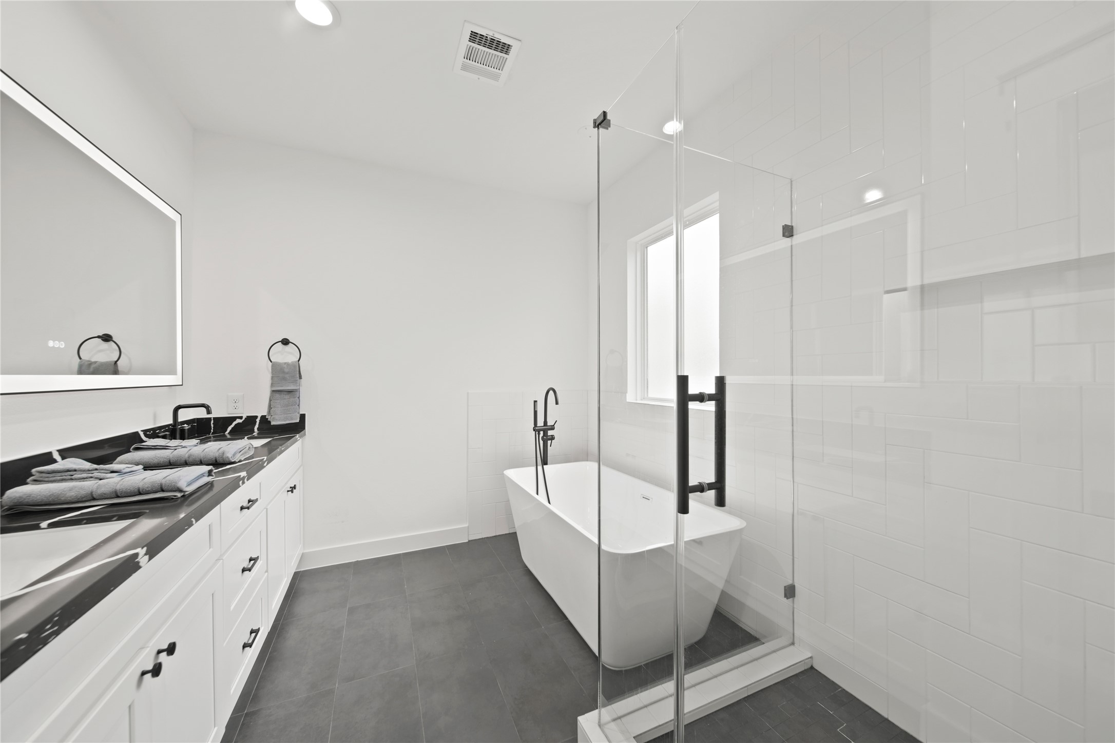 2510 Gray Street Houston, TX 77003 - Photo 7 of 15 a kitchen with white cabinets and appliances