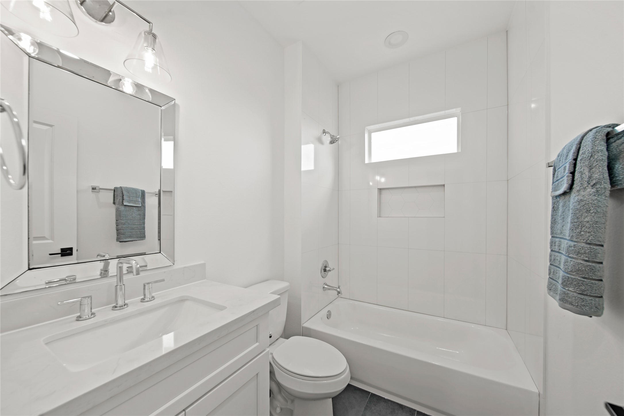 2510 Gray Street Houston, TX 77003 - Photo 9 of 15 a bathroom with a granite countertop sink a toilet and shower