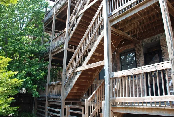 a view of balcony with wooden floor