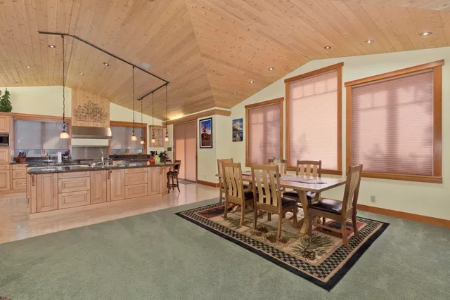 a view of a kitchen with kitchen island granite countertop a large window in it