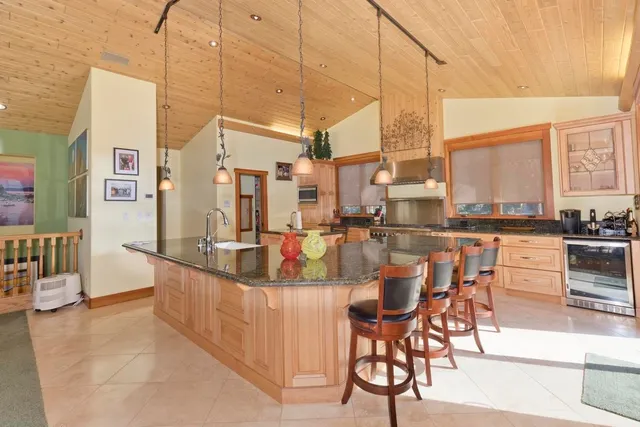 a view of a dining table chairs and chandelier