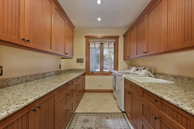a kitchen with a sink and cabinets