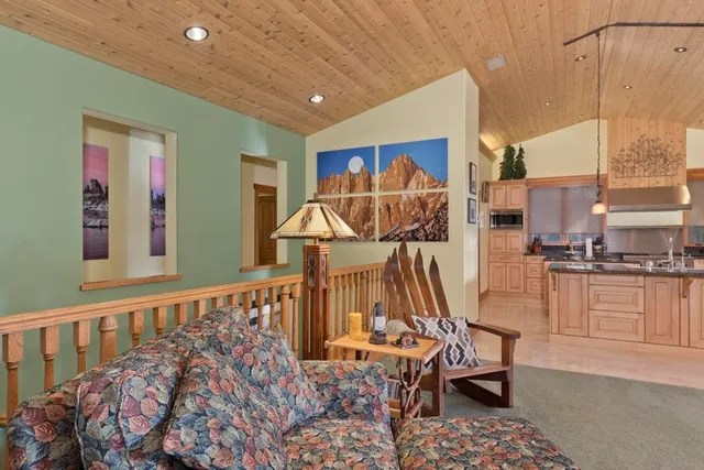 a view of a chairs and table in a balcony