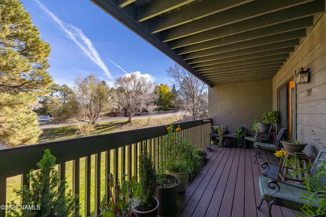 a view of balcony with furniture