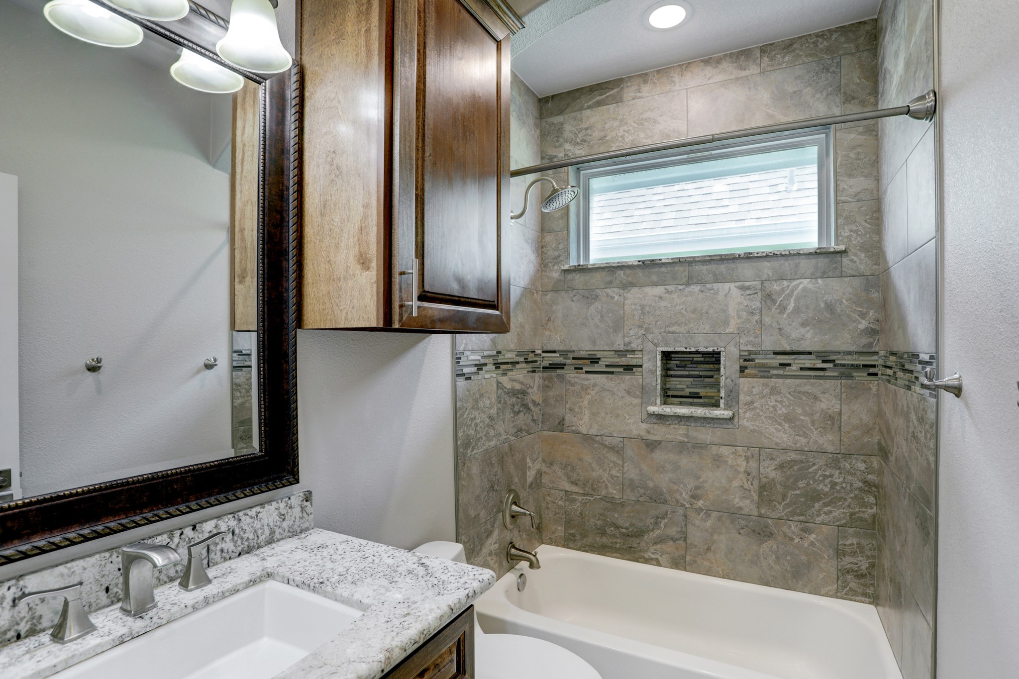 100 Grove Road, Unit D Kemah, TX 77565 - Photo 11 of 14 a bathroom with a sink and a mirror