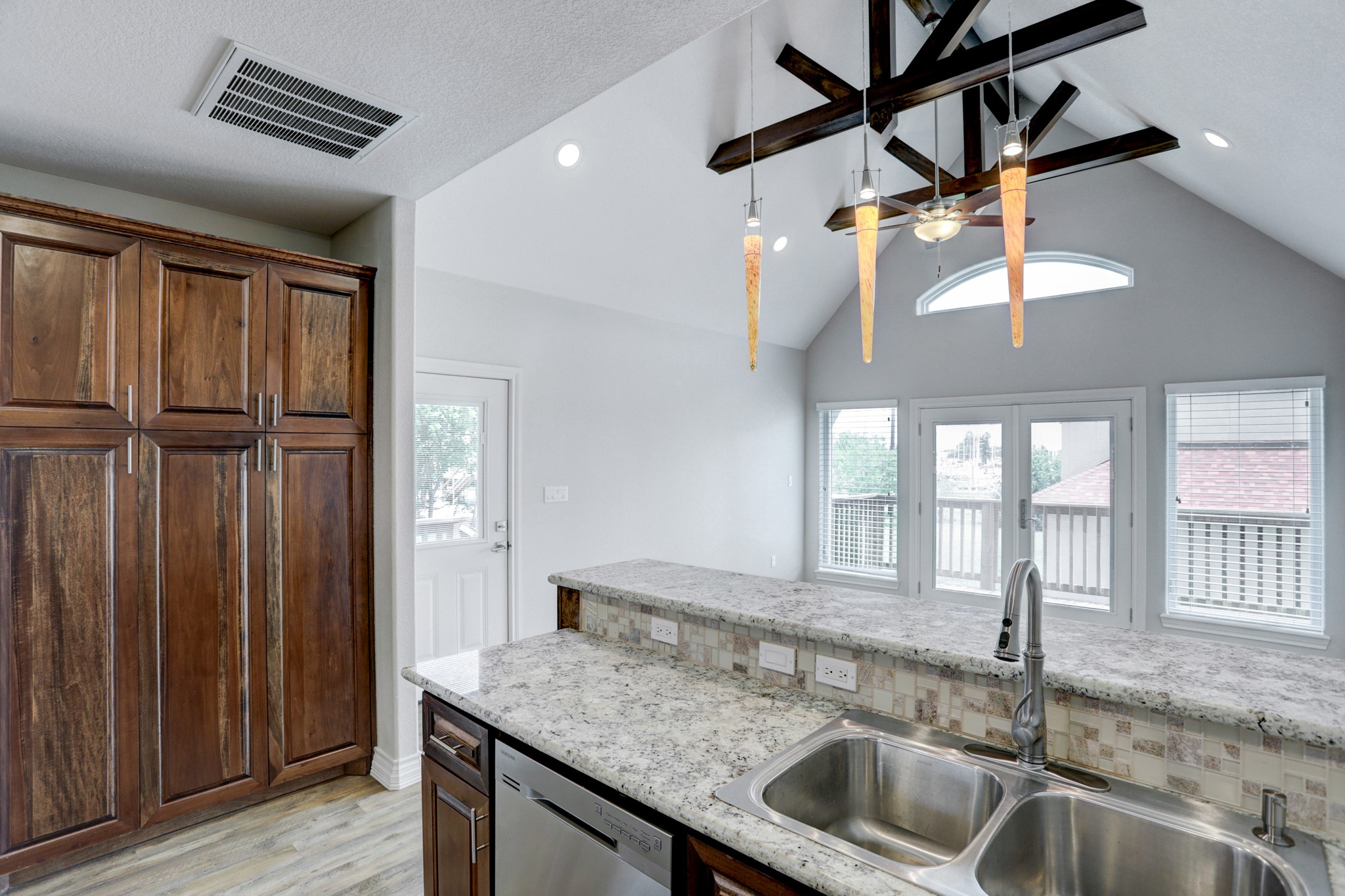 100 Grove Road, Unit D Kemah, TX 77565 - Photo 8 of 14 a kitchen with a sink a counter top space and cabinets