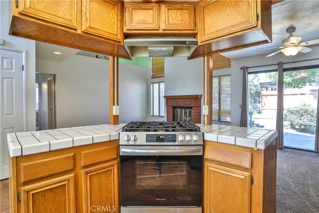 2003 Springcreek Circle Upland, CA 91784 - Photo 17 of 64 a kitchen with stainless steel appliances granite countertop a stove and a refrigerator