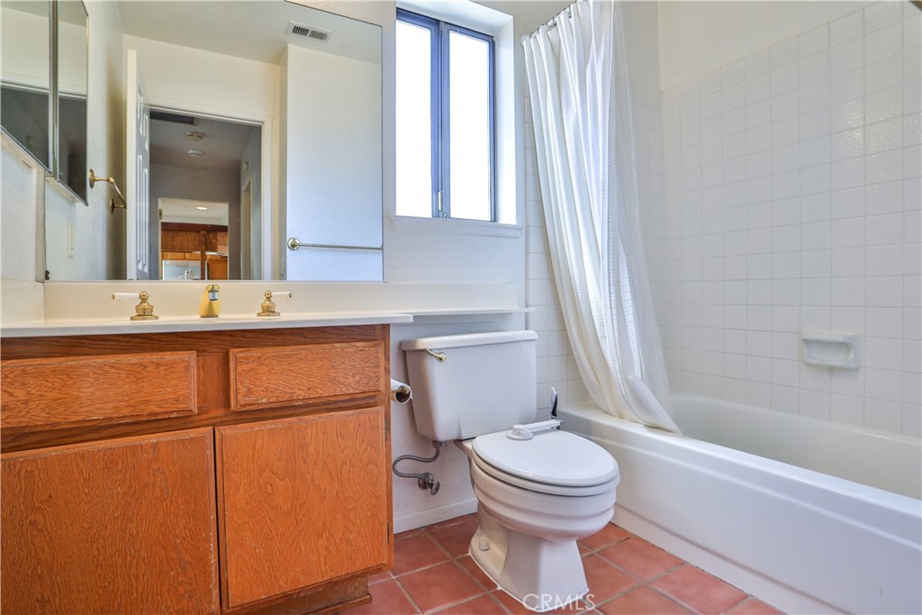2003 Springcreek Circle Upland, CA 91784 - Photo 26 of 64 a bathroom with a toilet sink and mirror