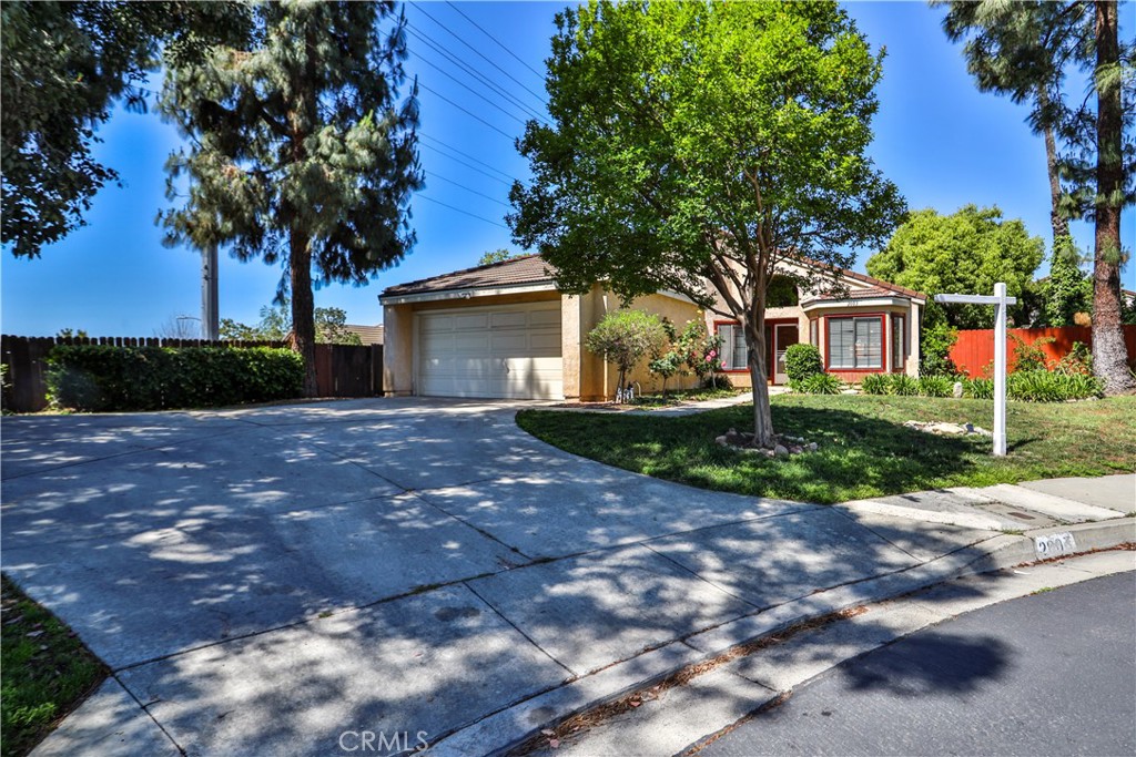 2003 Springcreek Circle Upland, CA 91784 - Photo 4 of 64 a front view of a house with a garden