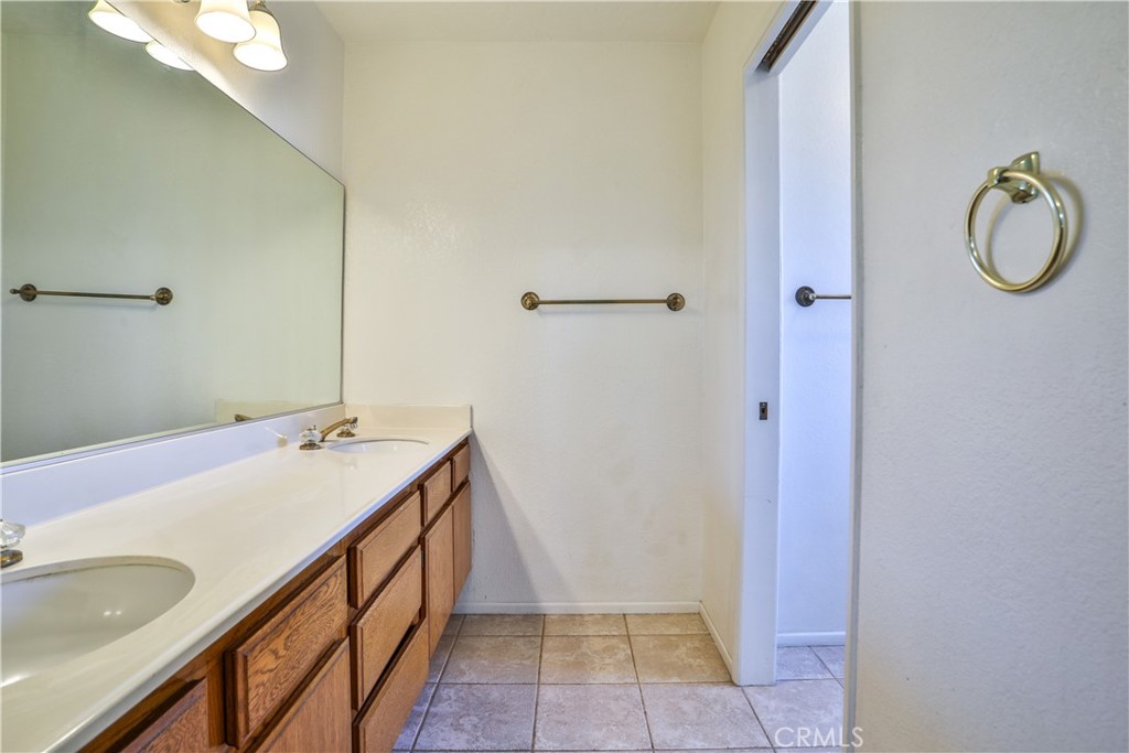 2003 Springcreek Circle Upland, CA 91784 - Photo 42 of 64 a bathroom with a sink and a mirror