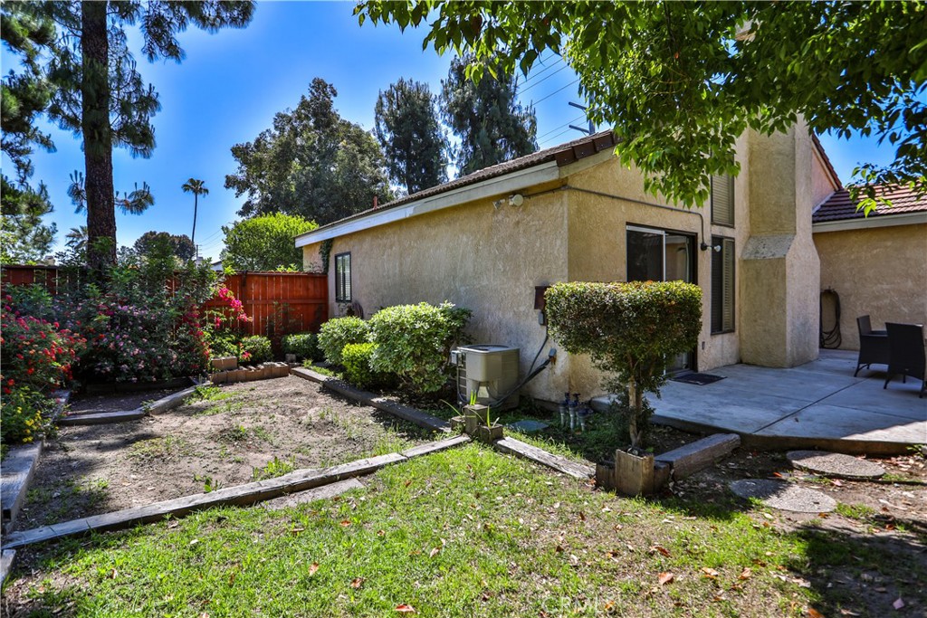 2003 Springcreek Circle Upland, CA 91784 - Photo 48 of 64 a backyard of a house with table and chairs plants