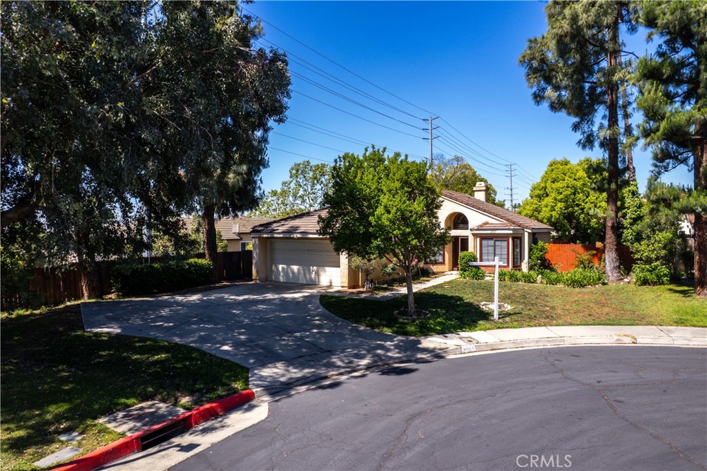 2003 Springcreek Circle Upland, CA 91784 - Photo 5 of 64 a front view of a house with a yard and garage