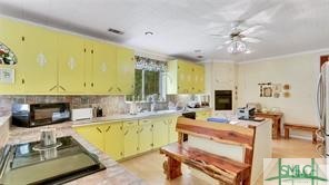 1979 South Coastal Highway Riceboro, GA 31323 - Photo 28 of 48 The large window over the kitchen sink looks out o
