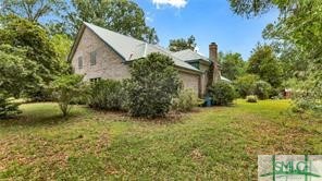 1979 South Coastal Highway Riceboro, GA 31323 - Photo 40 of 48 This is the side of the home opposite the garages.