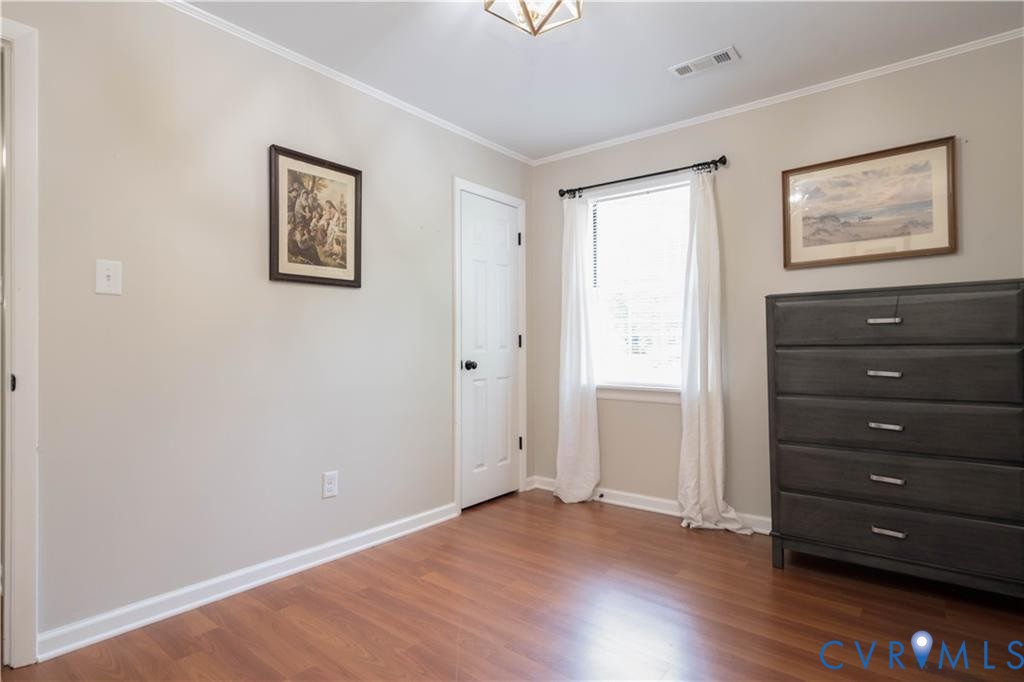 9910 Husting Court Chesterfield, VA 23832 - Photo 9 of 19 wooden floor in an empty room with a window