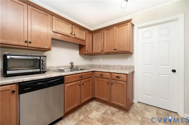 a kitchen with stainless steel appliances granite countertop cabinets and a sink