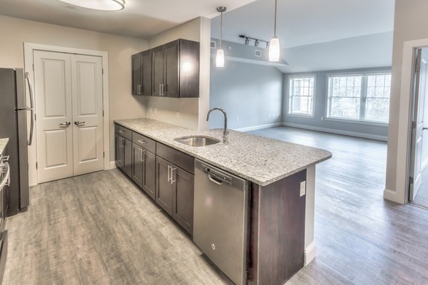 373 Commonwealth Road, Unit 207 Wayland, MA 01778 - Photo 2 of 5 a kitchen with a sink refrigerator and window