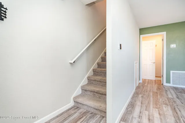 a view of entryway with wooden floor