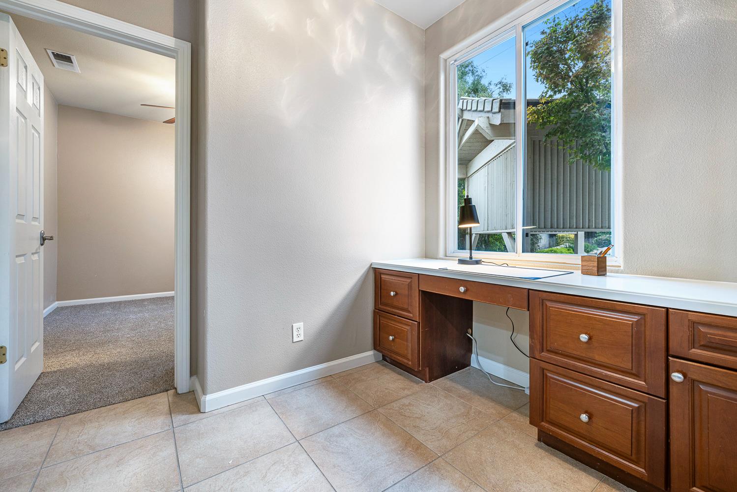 4674 North Arrow Ridge Way Clovis, CA 93619 - Photo 28 of 77 a bathroom with a sink and a mirror