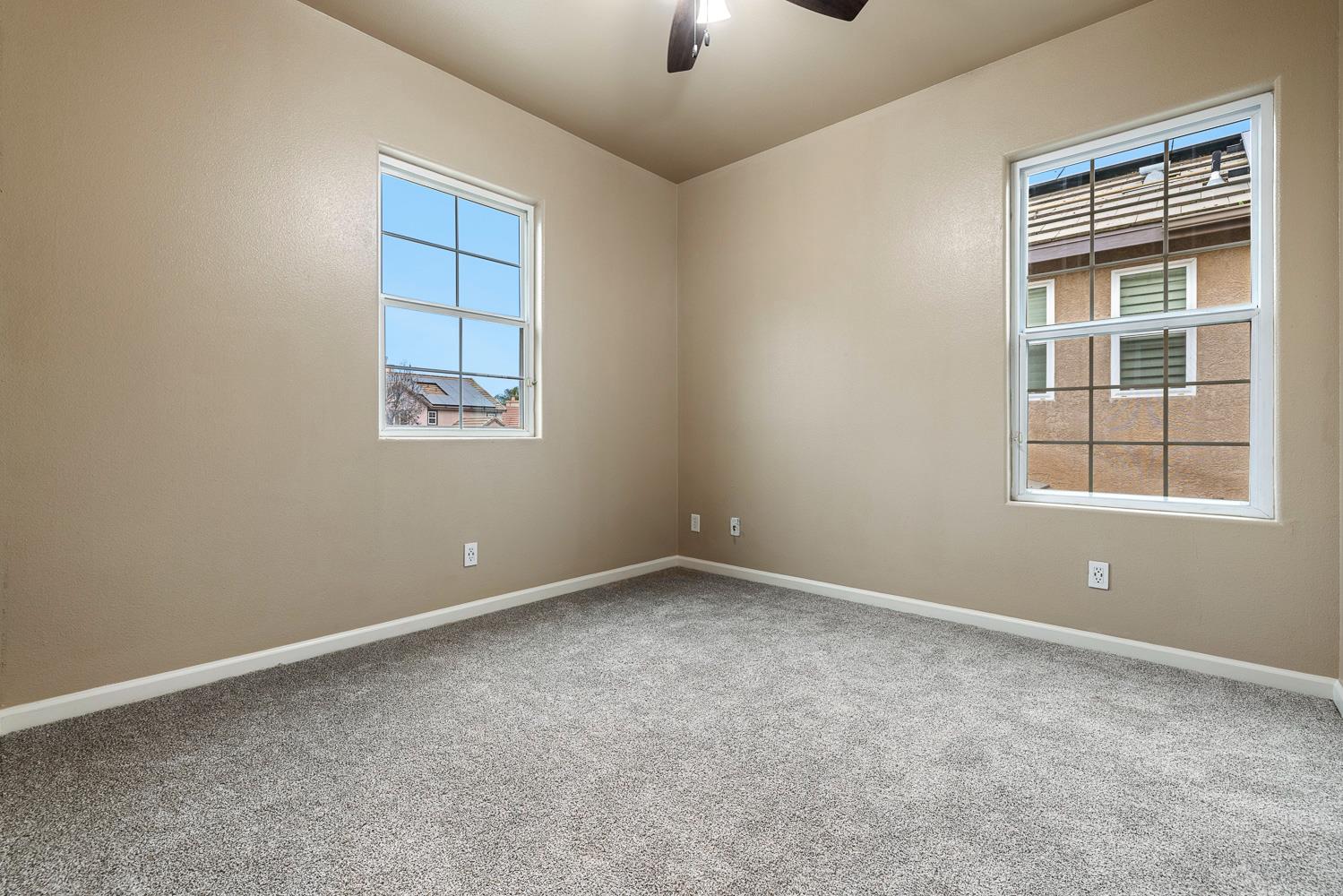4674 North Arrow Ridge Way Clovis, CA 93619 - Photo 44 of 77 an empty room with windows and closet