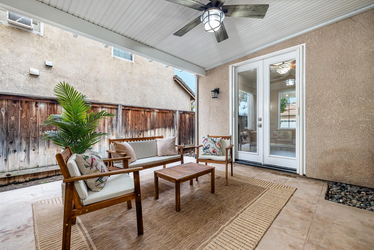 4674 North Arrow Ridge Way Clovis, CA 93619 - Photo 53 of 77 a living room with furniture and a potted plant