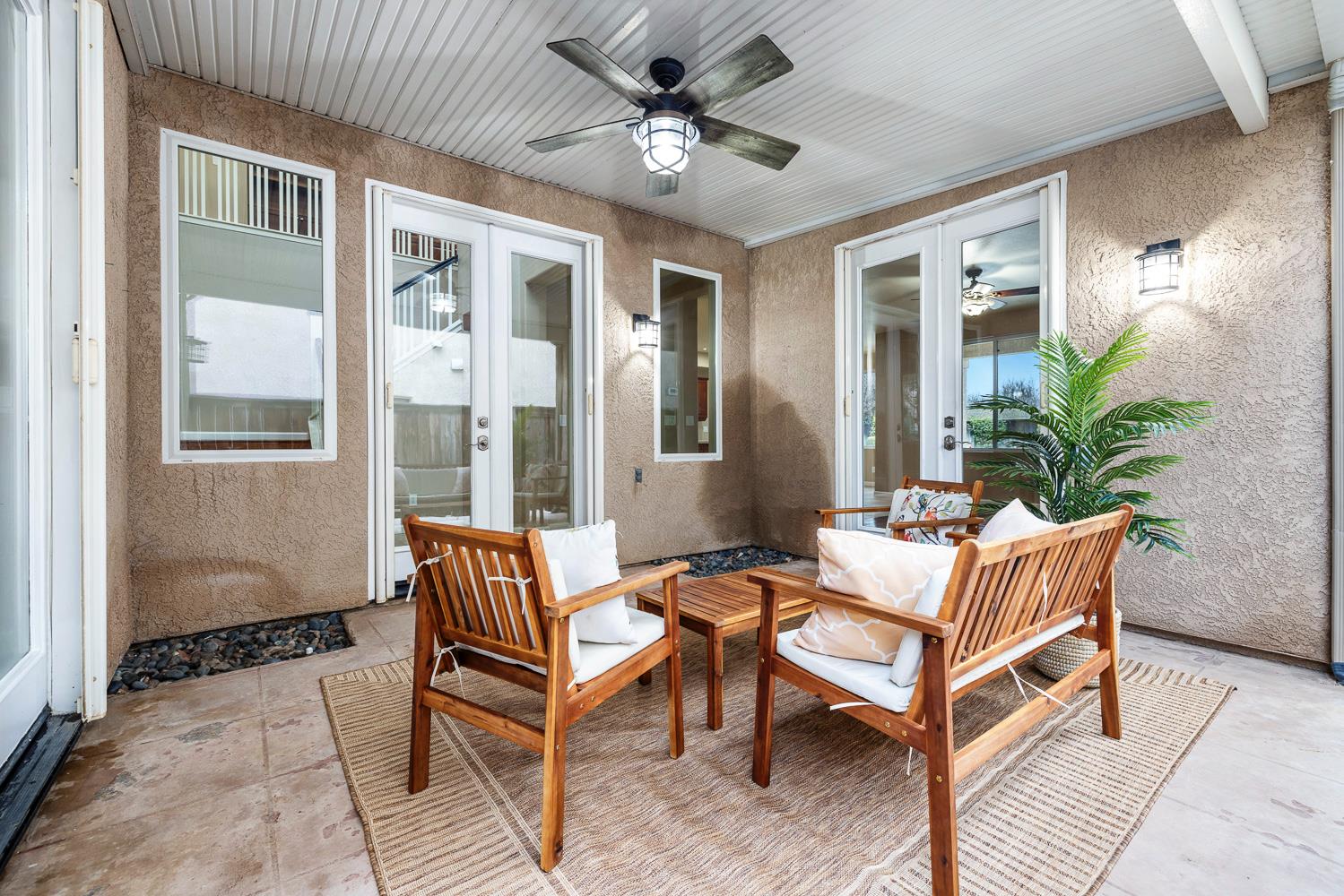 4674 North Arrow Ridge Way Clovis, CA 93619 - Photo 54 of 77 a outdoor living space with furniture and a potted plant